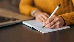 Writing notes in a notepad