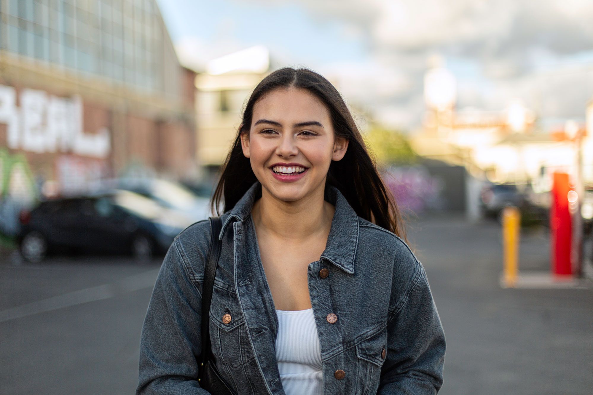 Girl in denim jacket smiling