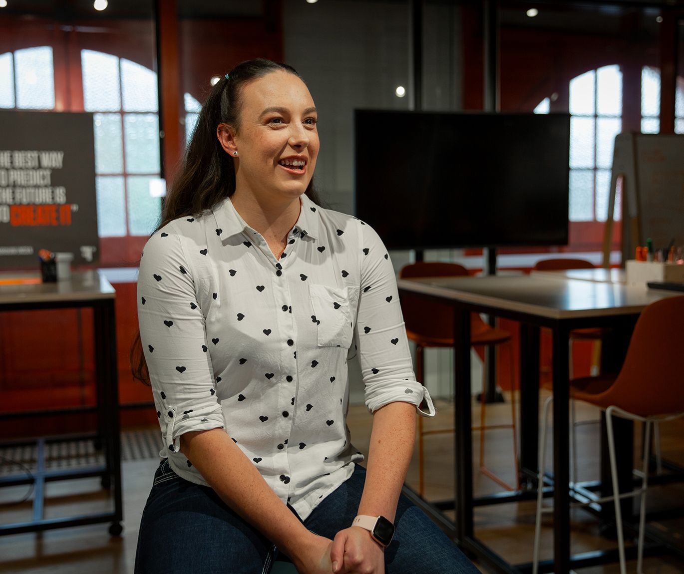Female student being interviewed about their experience at Swinburne University, sitting in a classroom and speaking to the interviewee.