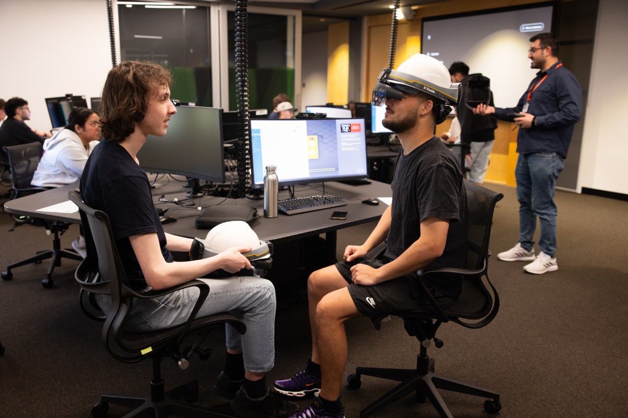 Students using the Trimble XR10 mixed reality headset for construction planning and progress monitoring.