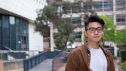 International student Duc from Vietnam standing outside ATC Building on Hawthorn campus.