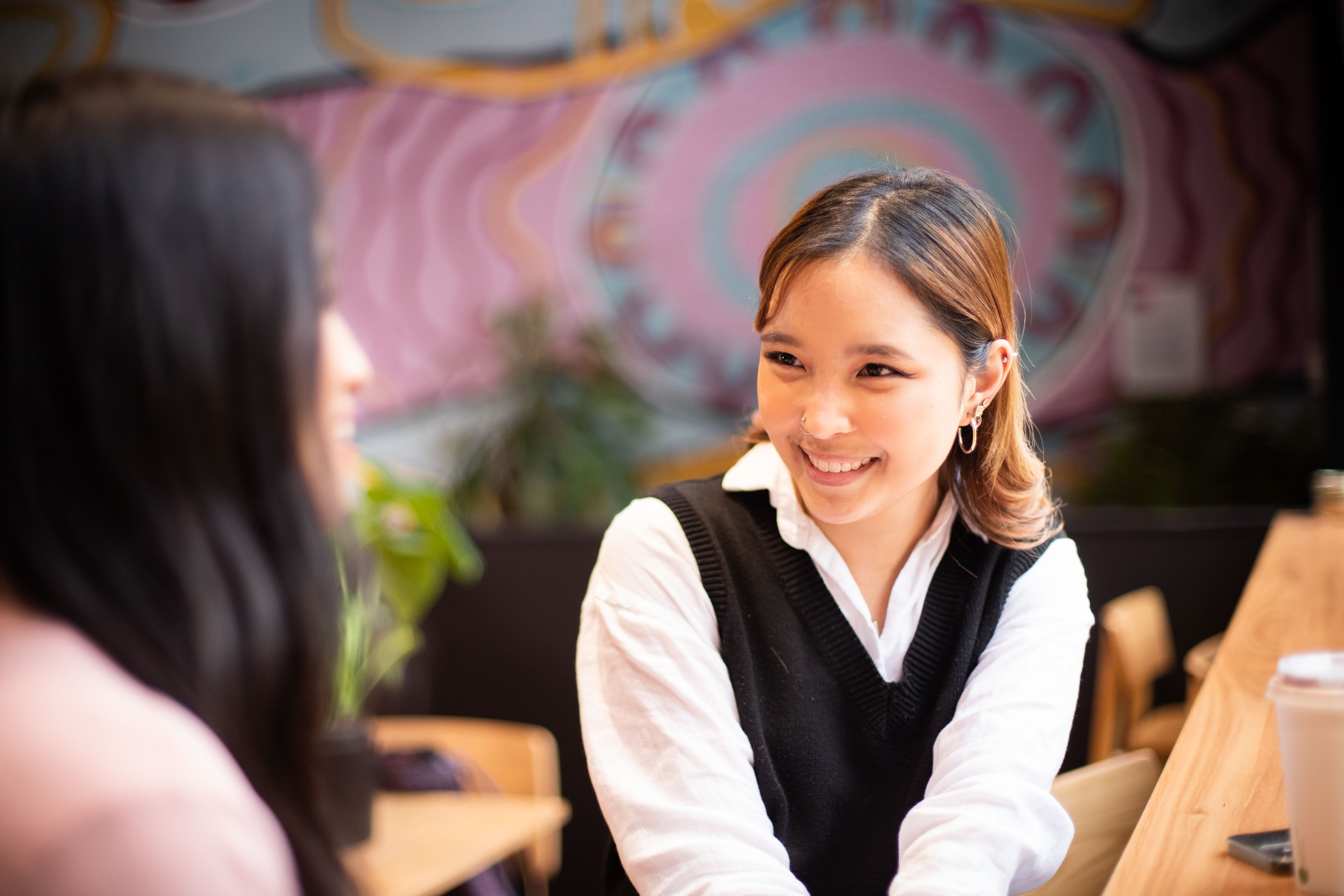 International student Nayli Shamubin faces the camera, smiling.