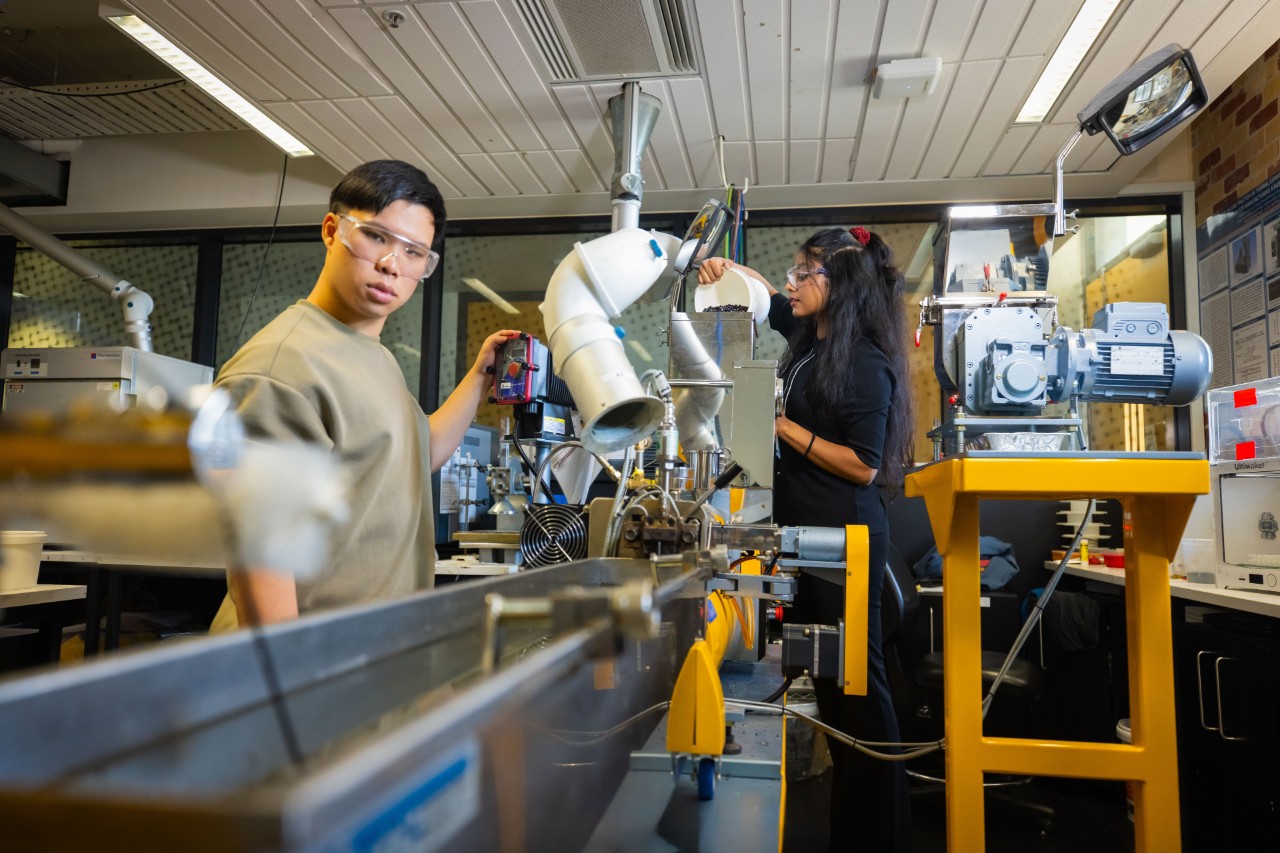 Students using the LabTech LTE16-40 Twin screw extruder to manufacture versatile polymer profiles in the Polymer Processing and Testing Lab