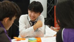 School boy in a group discussion