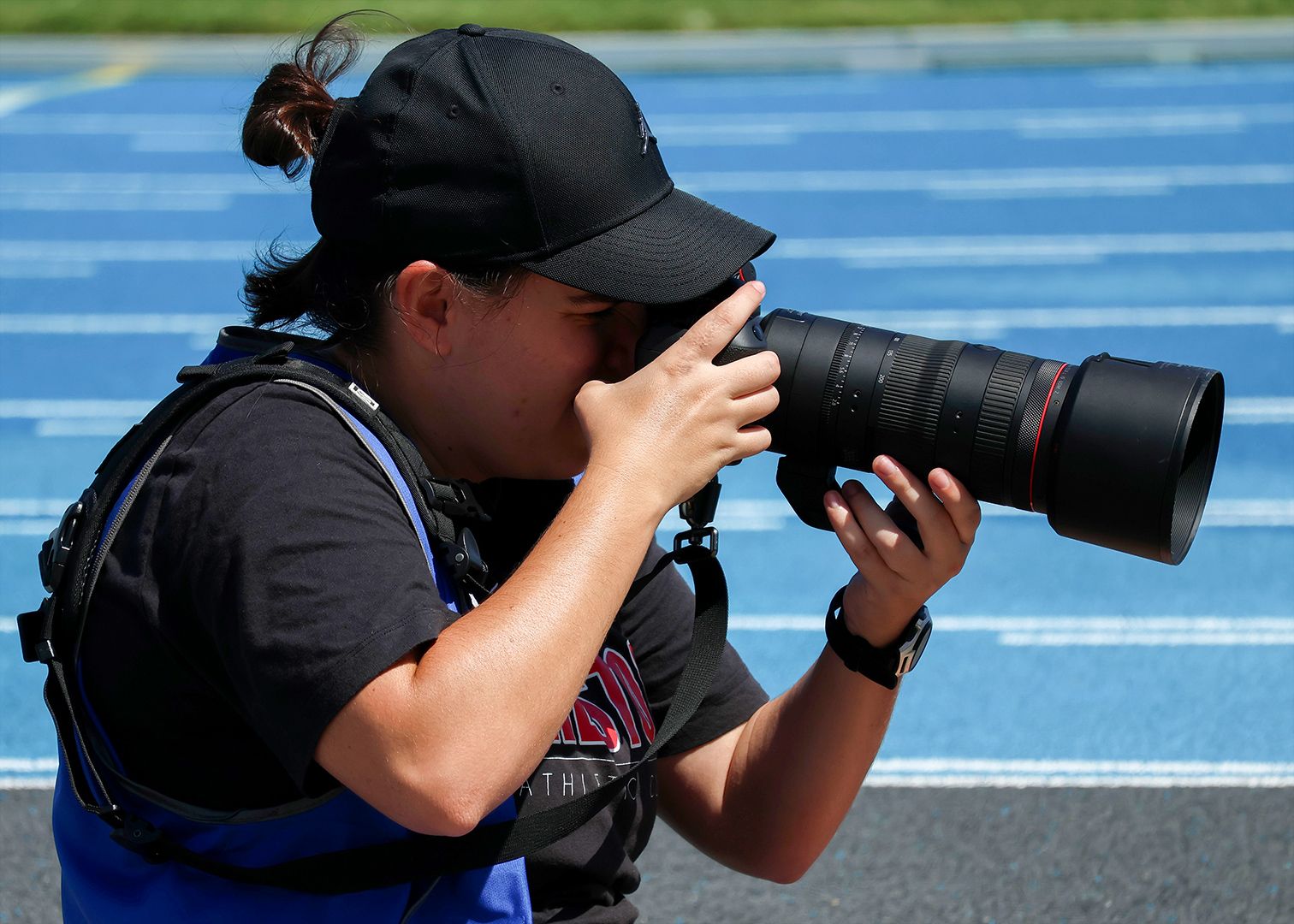 Swinburne design alum Joanna Margiolis taking photos at her local athletics club