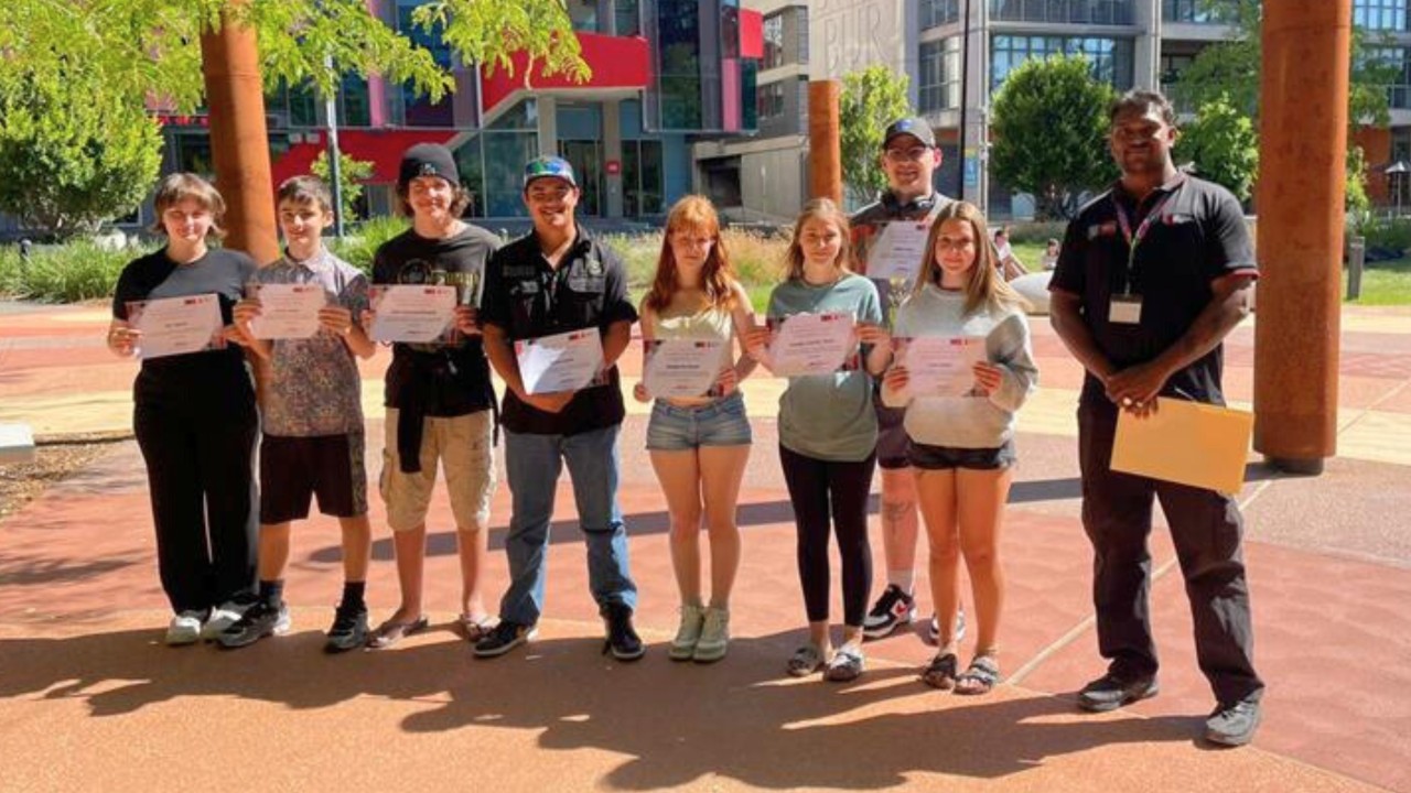 MTC-FAC attendees receiving their camp completion certificates at the family gathering event at the Indigenous Learning Circles at Swinburne's Hawthorn campus.