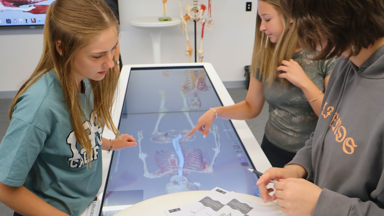 MTC-FAC attendees working with health sciences augmented reality digital cadavers to explore key insights into the human body.