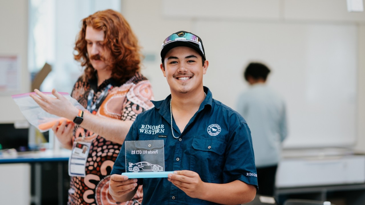 MTC-FAC attendee completing a laser-engraved stand in the STEM workshop at the Knox Innovation, Opportunity and Sustainability Centre (KIOSC) on Swinburne's Wantirna campus.