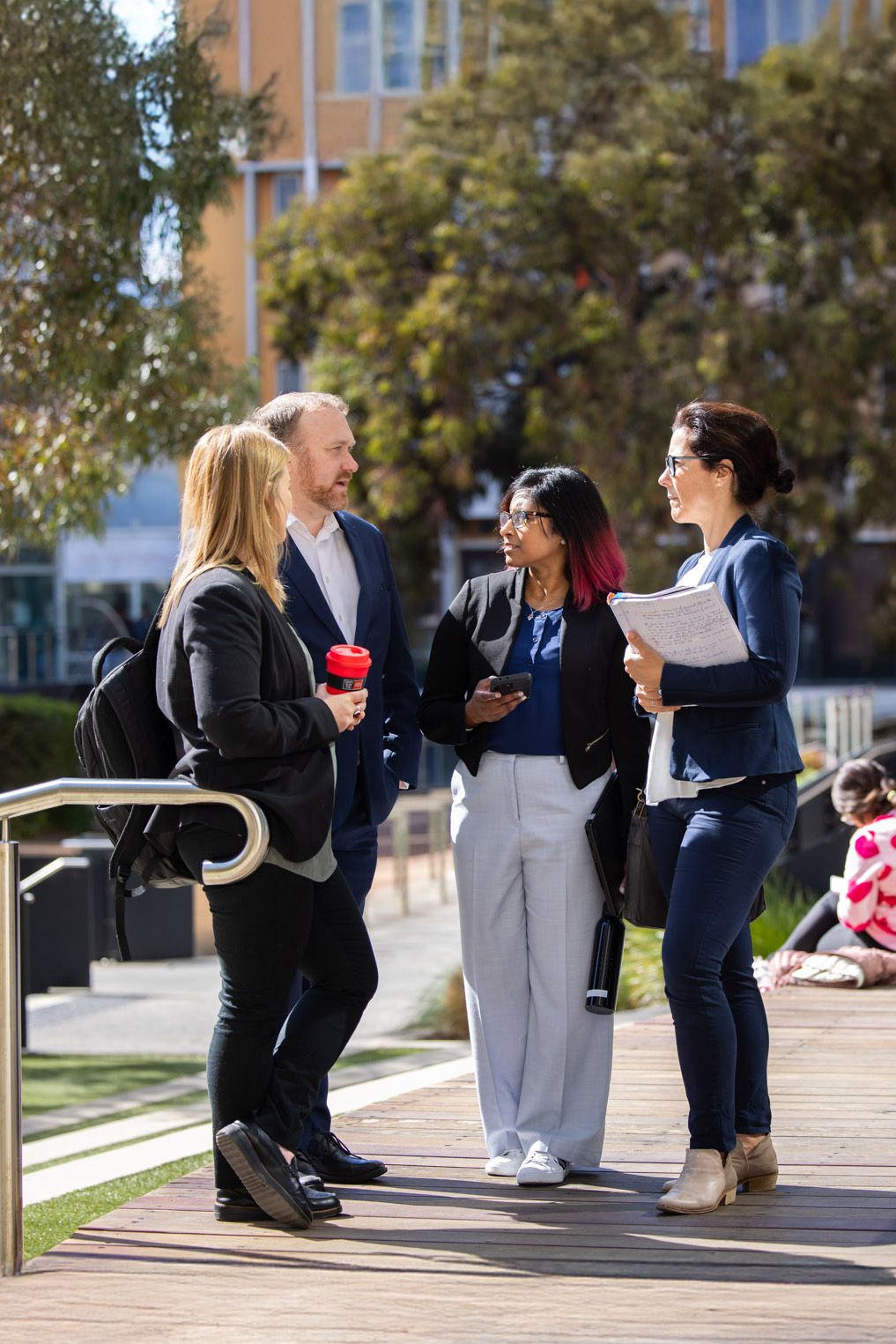 4 people having a conversation