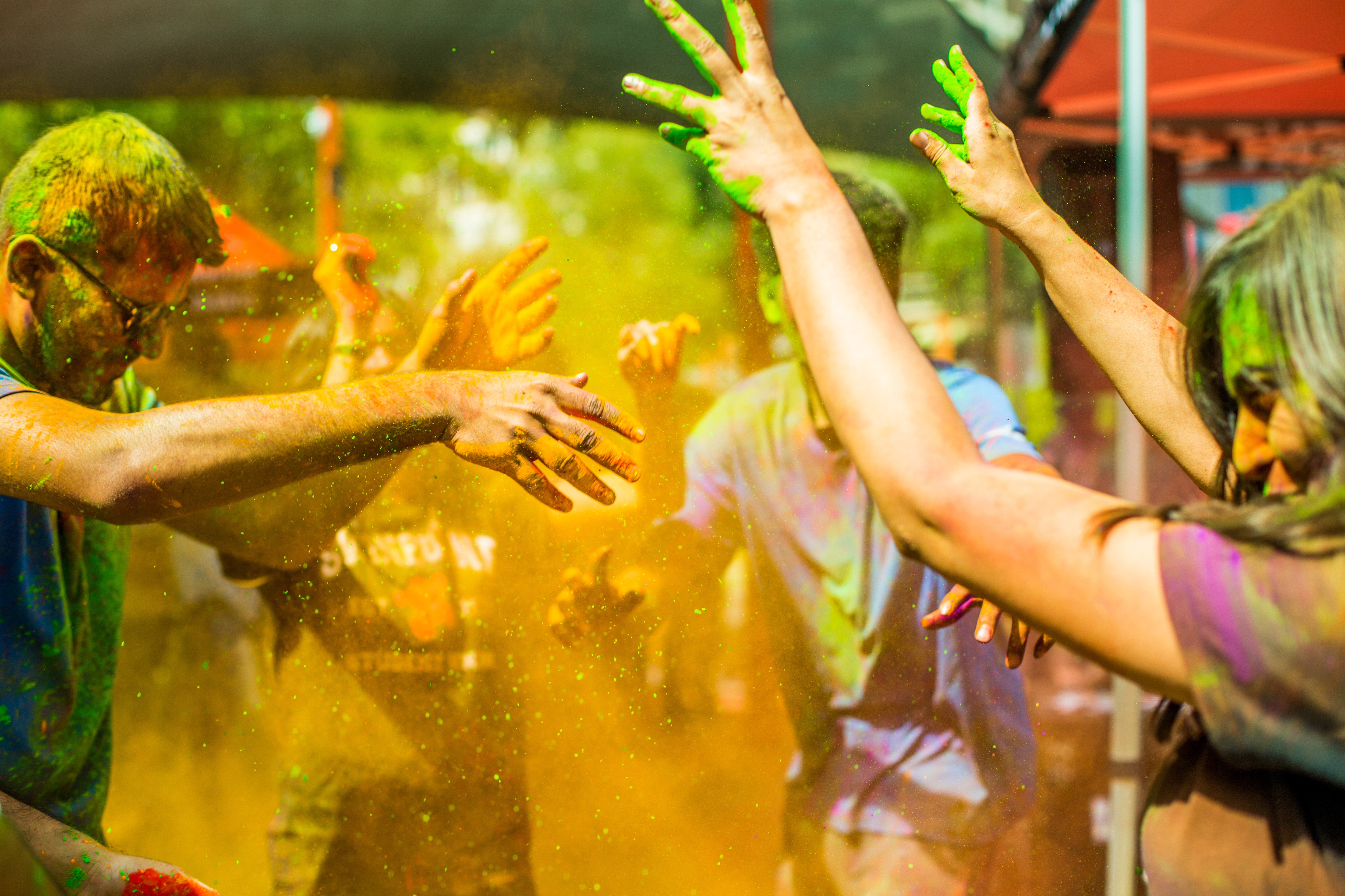 Students celebrating the Holi festival on campus throwing paint
