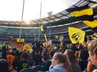 Students attend an AFL game at the Melbourne Cricket Ground (MCG)