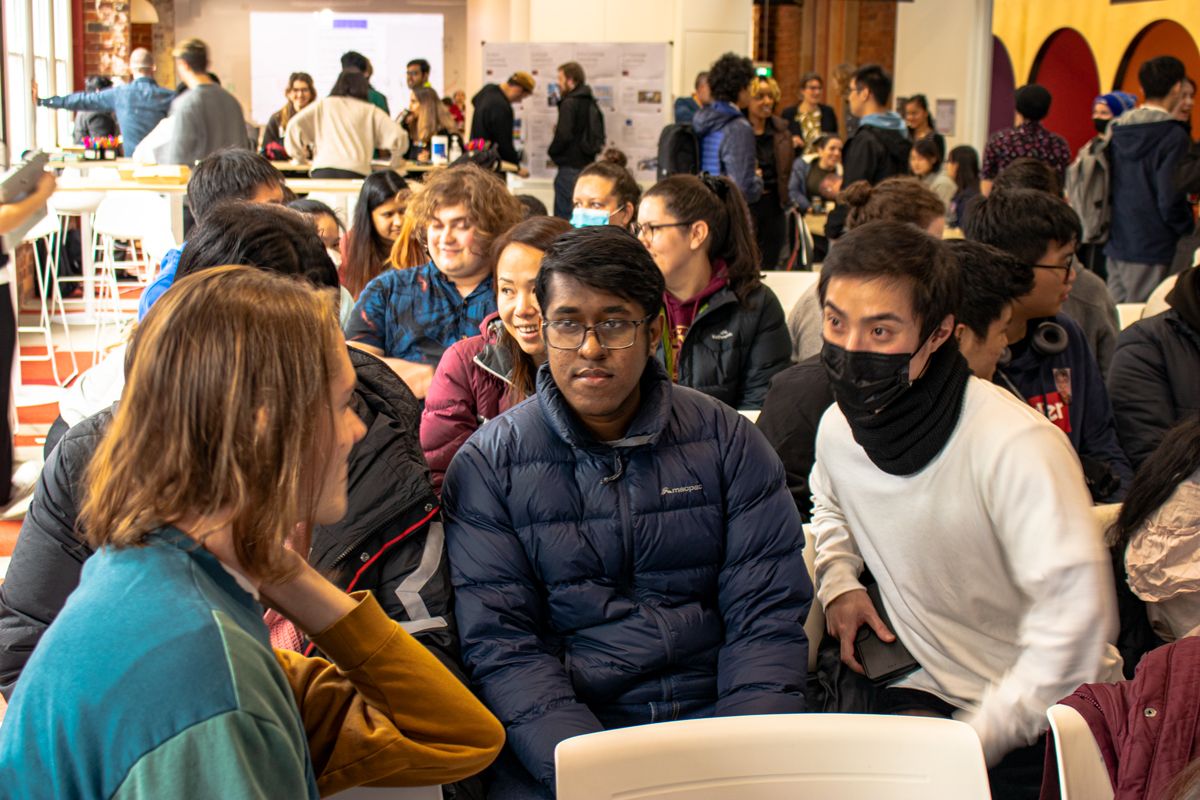 Swinburne students sitting together having a discussion