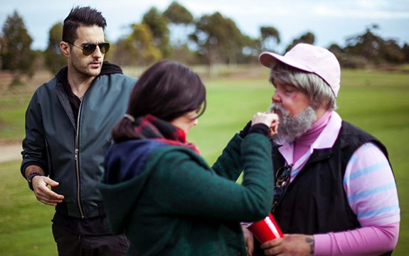 Swinburne alumnus and filmmaker, Nick Kozakis (left) on set of the ‘Dance Monkey’ music video. 