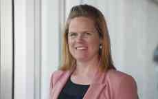 Close up of Bec Grice smiling in pink jacket