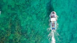 Birds eye view of boat on the water in Fiji.