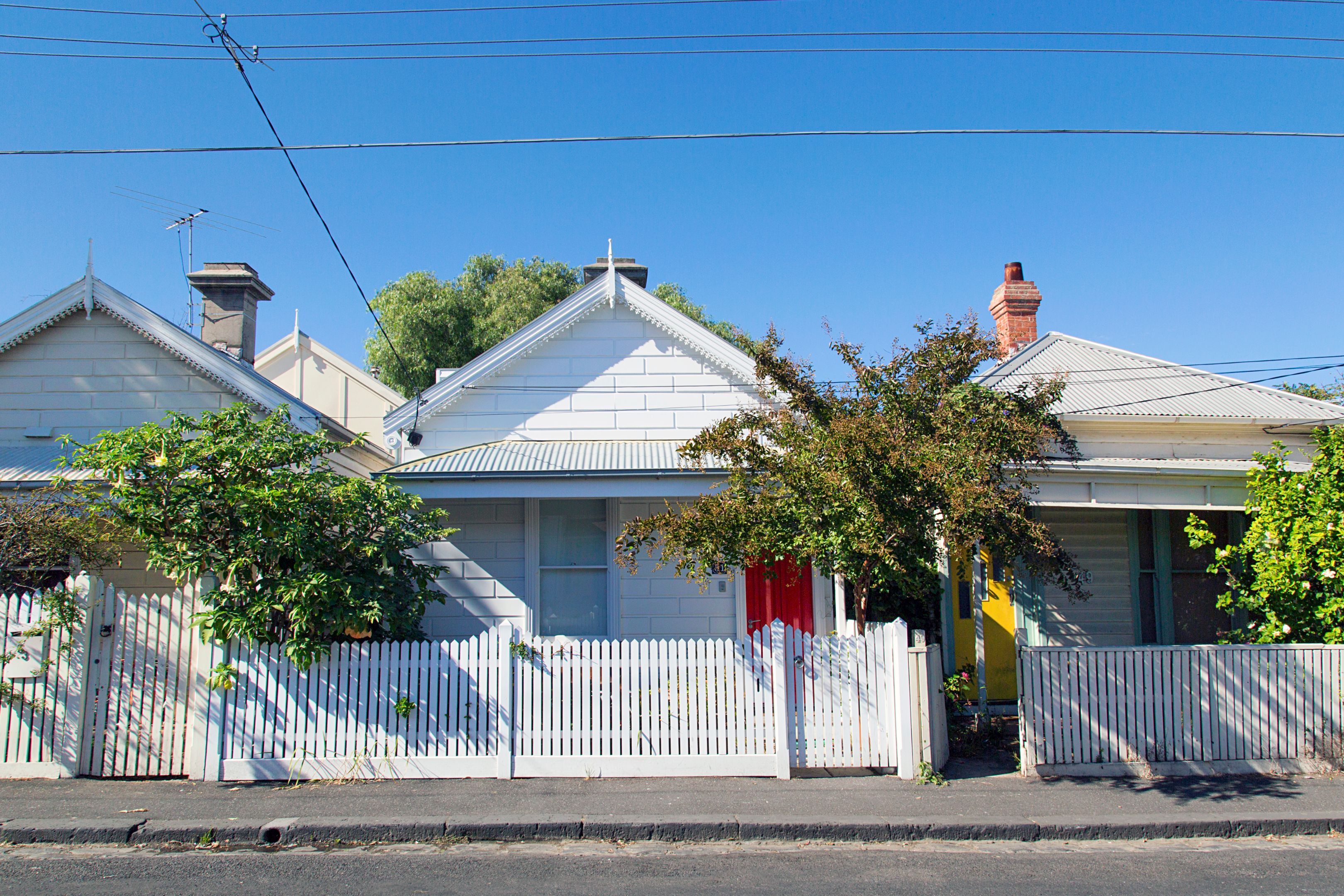 Charming bungalow homes with white picket fence.