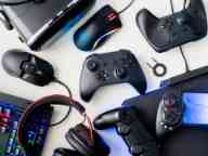 Gamer workspace, top view a gaming gear, mouse, keyboard, joystick, headset and mouse pad on white table background.