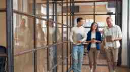 Young creative people in modern office. Group of young business people hipster team are working together in coworking . Freelancers