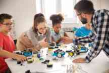 Kids working on a robot design