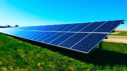 A solar panel on a grass field
