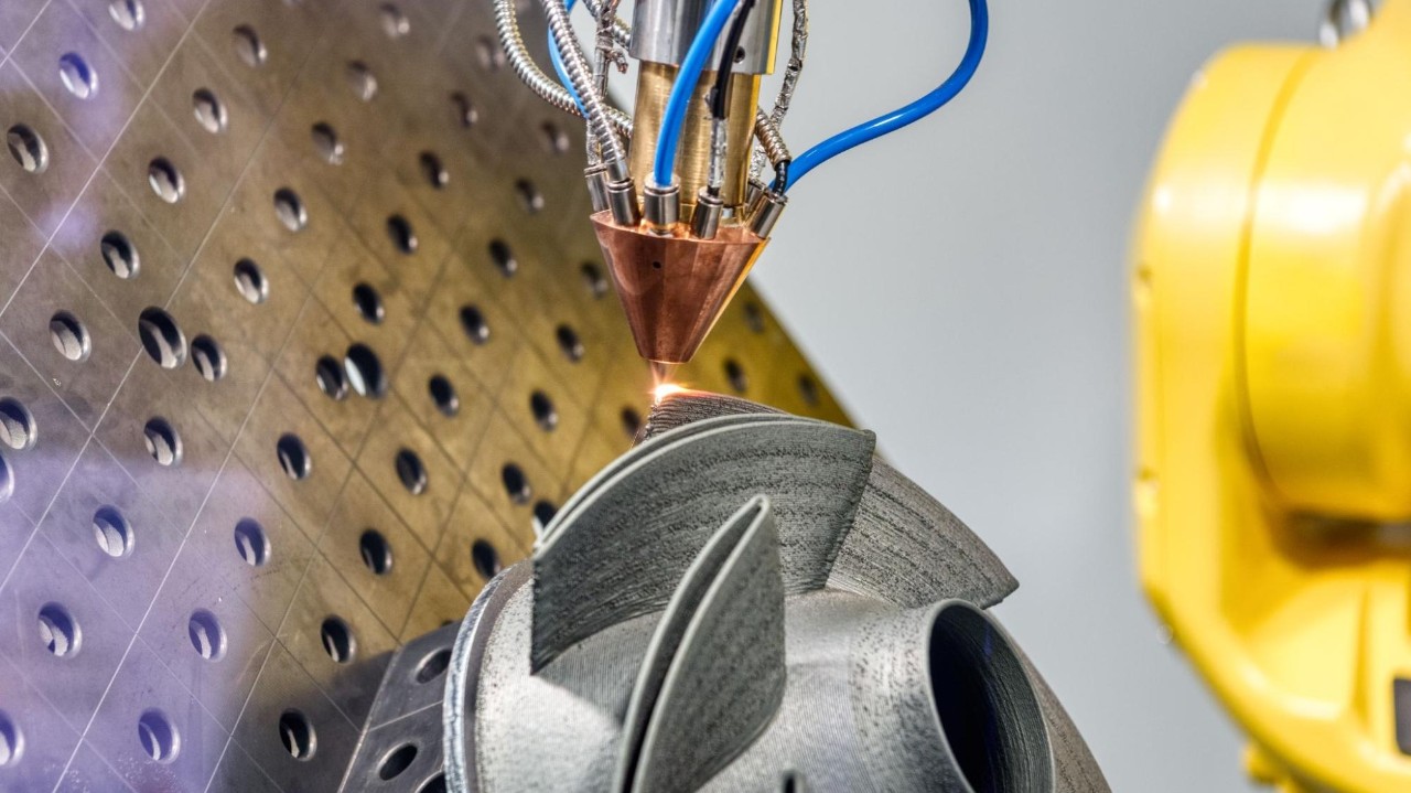 An example of laser directed energy deposition in advanced manufacturing process where detailed features are being applied on an additively manufactured component.