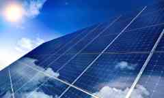 sun shining on solar panels