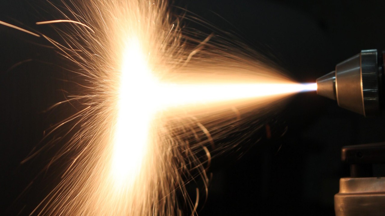 An example of thermal spray process in materials and coatings where ceramic thermal barrier coating is being applied on an industry partner's prototype component.