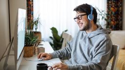 A man working from home using his desktop computer