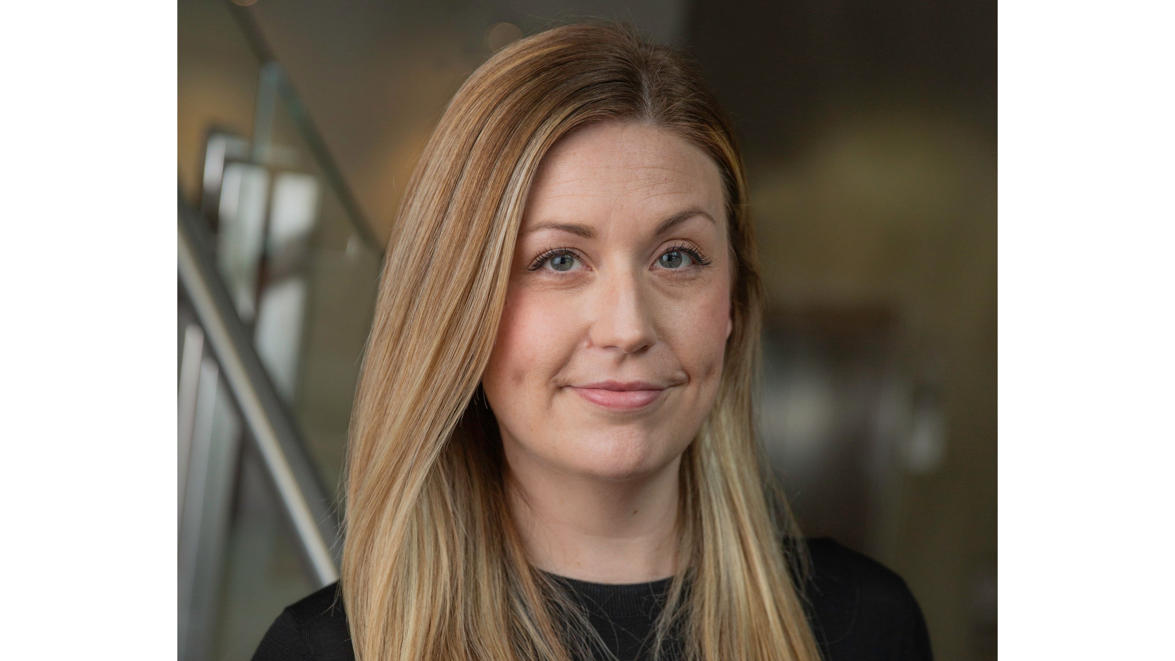 Close up of Zoe Shew looking to camera in a black top