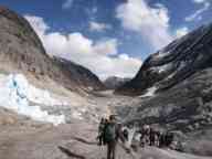 Students hiking through a snowy mountain pass