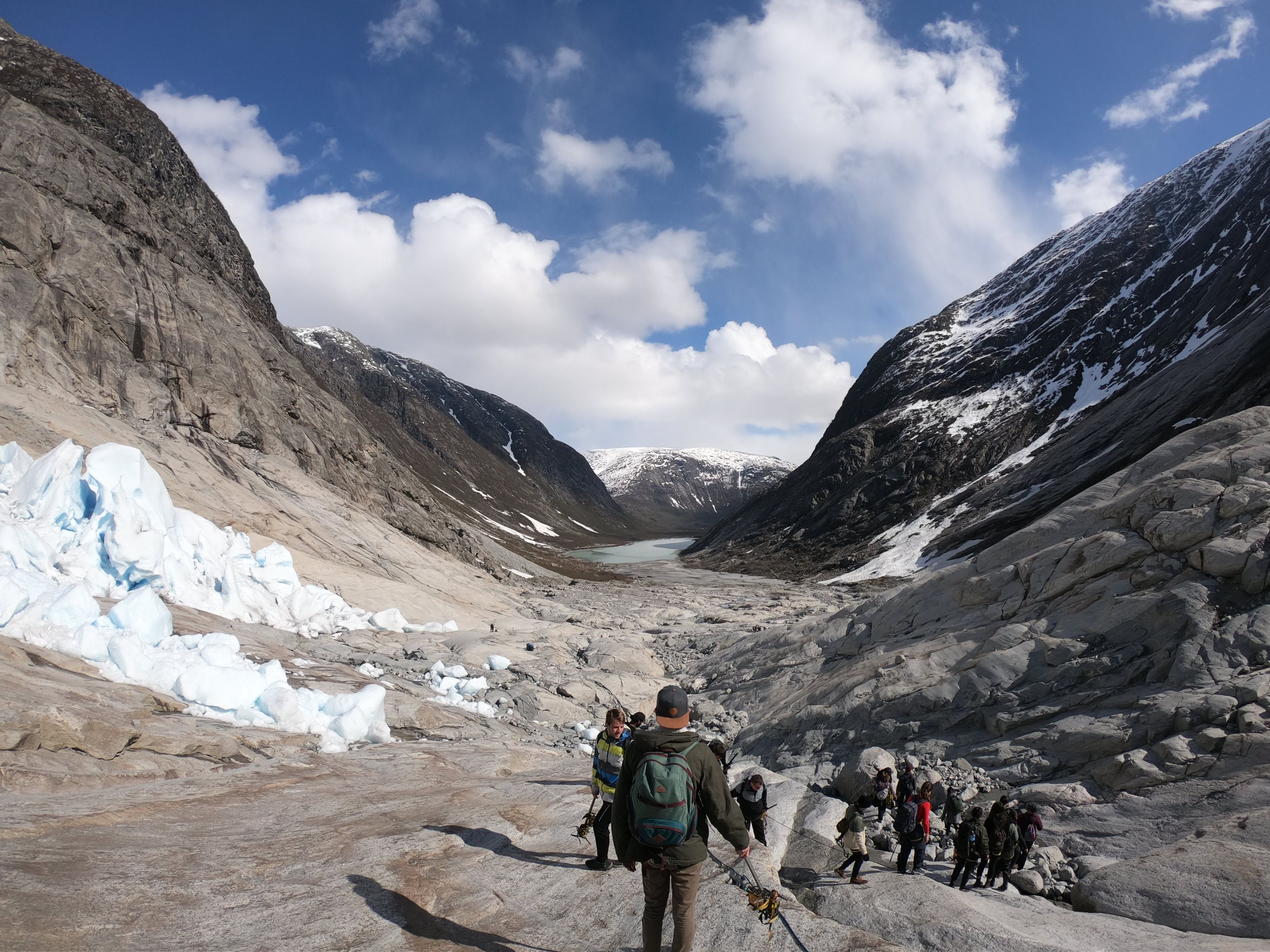 Students hiking through a snowy mountain pass