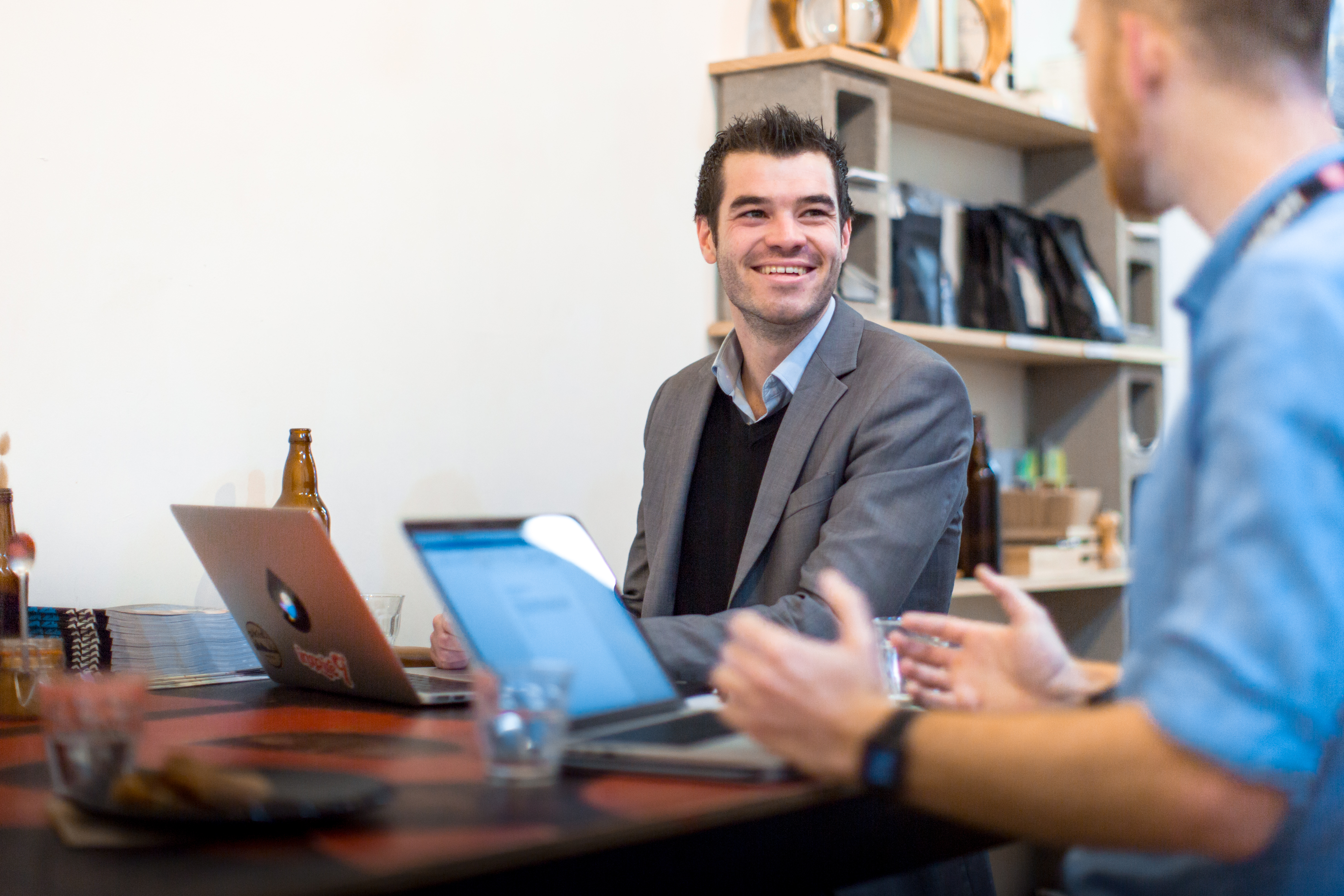 Male student working at a job after graduation