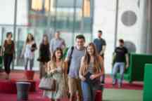 Three undergraduate students walking to their next lecture at the Hawthorn campus 