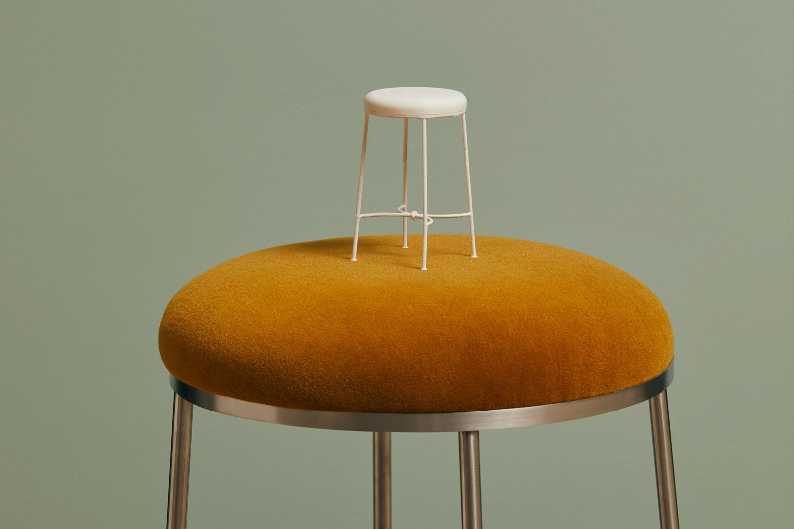 Lachlan Mackay product design from his studio Spaceman Studio, small design concept of a chair on top of the finished design 