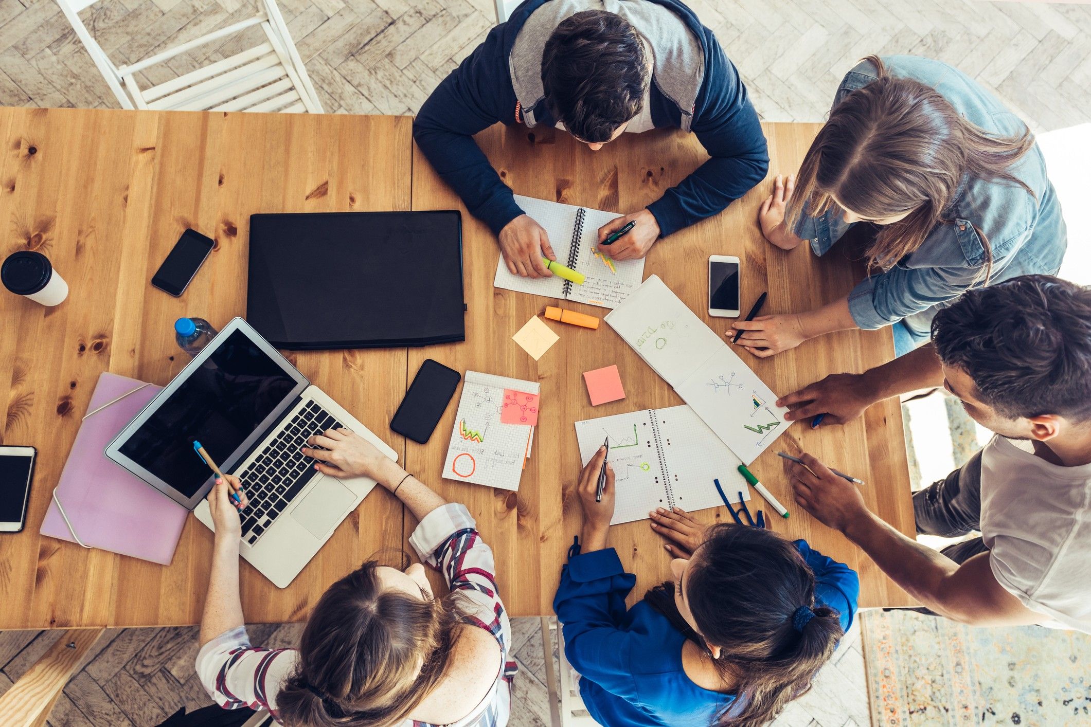 Students doing group work around a table