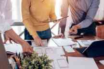 Teamwork process, Young designers planning work together on website ux app development.