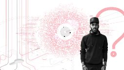 Guy wearing hoodie and cap on white background with a question mark and lots of interconnecting red and grey dots, lines and circles.