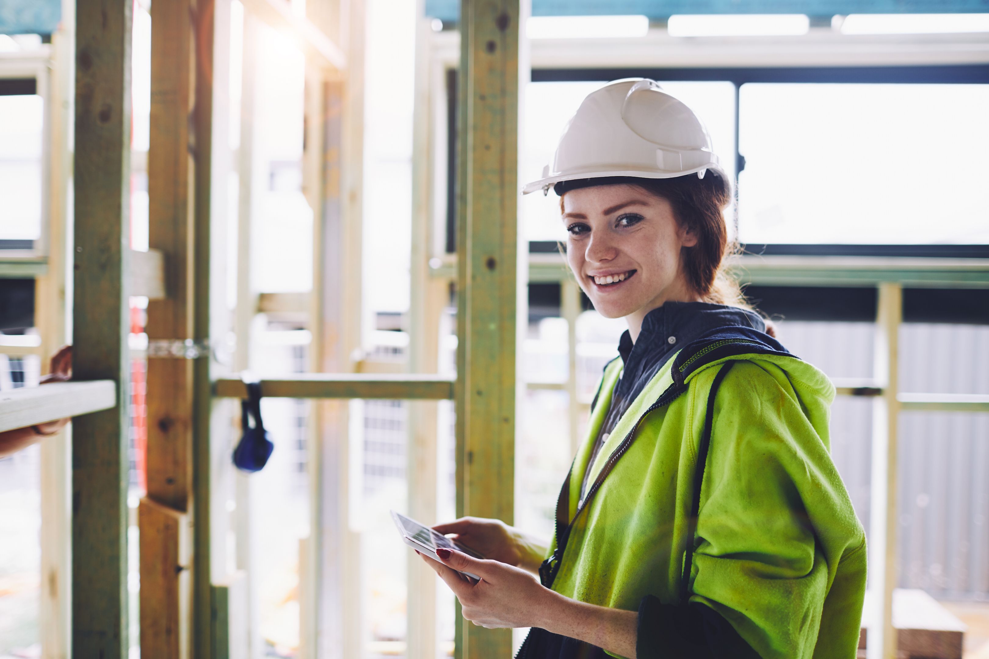 Construction workers in Australian in building site working and doing tasks.