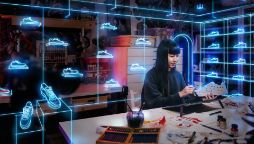 woman holding shoe with light painting of various shoe design for her business